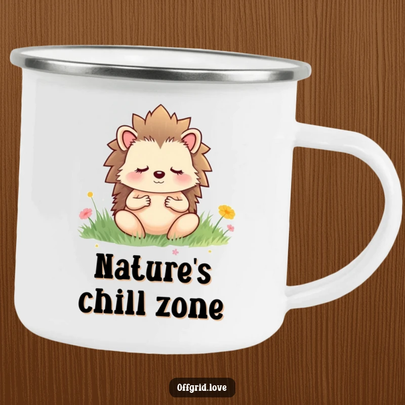 Funny camping mug with a meditating hedgehog in a serene meadow, perfect for enjoying drinks outdoors with a calm vibe.