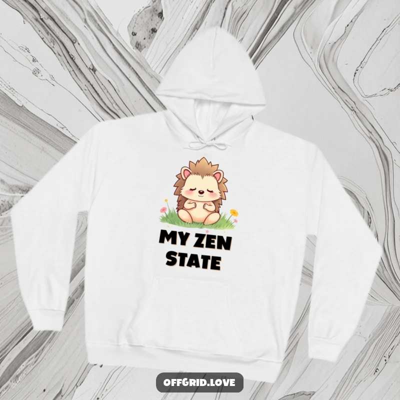 Funny hoodie featuring a meditating hedgehog in a peaceful meadow, offering comfort and a touch of gentle humor.